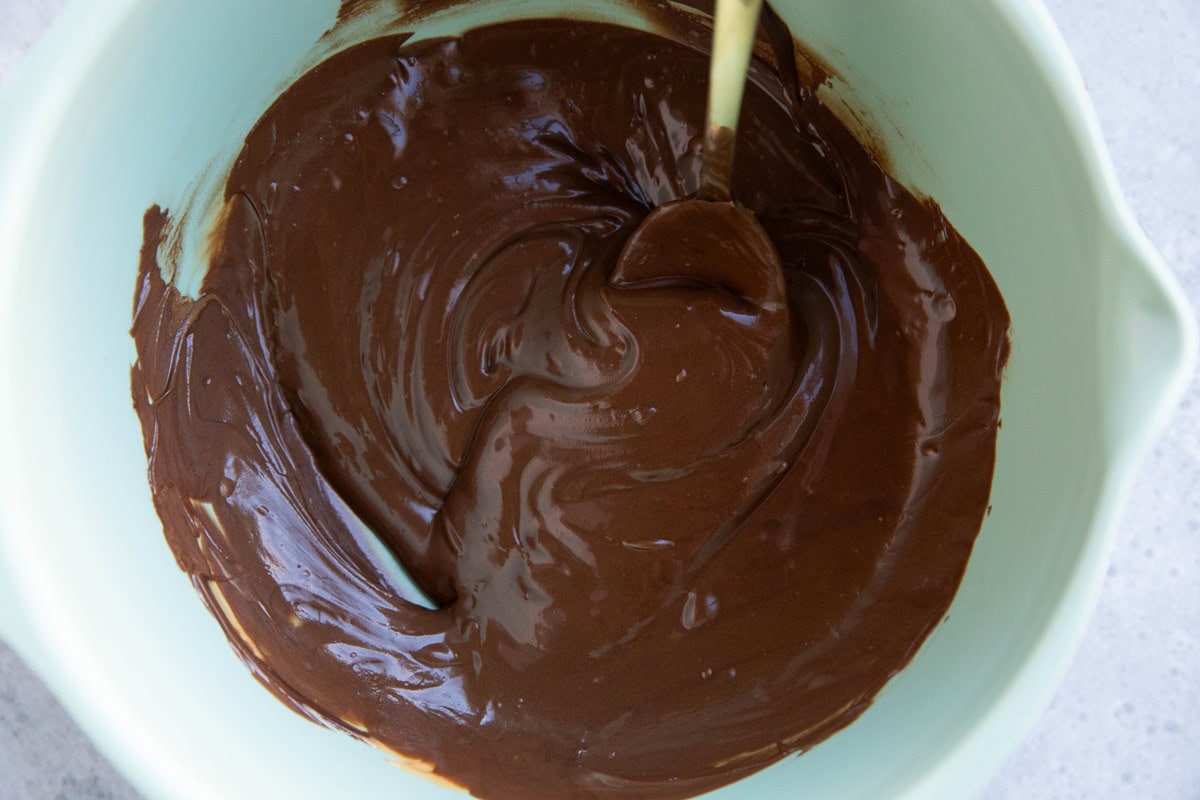 Melted chocolate in a mixing bowl.