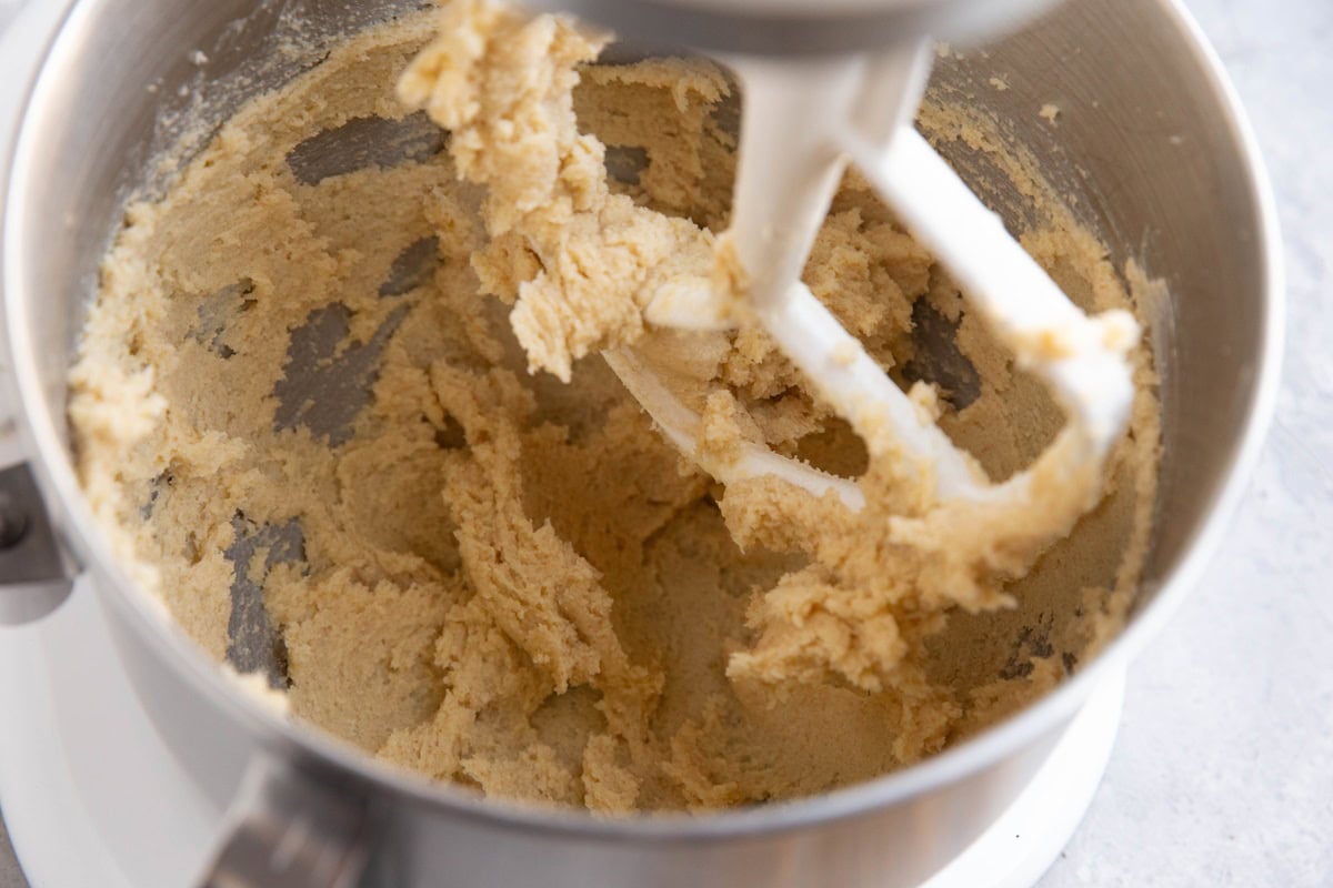 Butter and sugar in a stand mixer with paddle attachment.