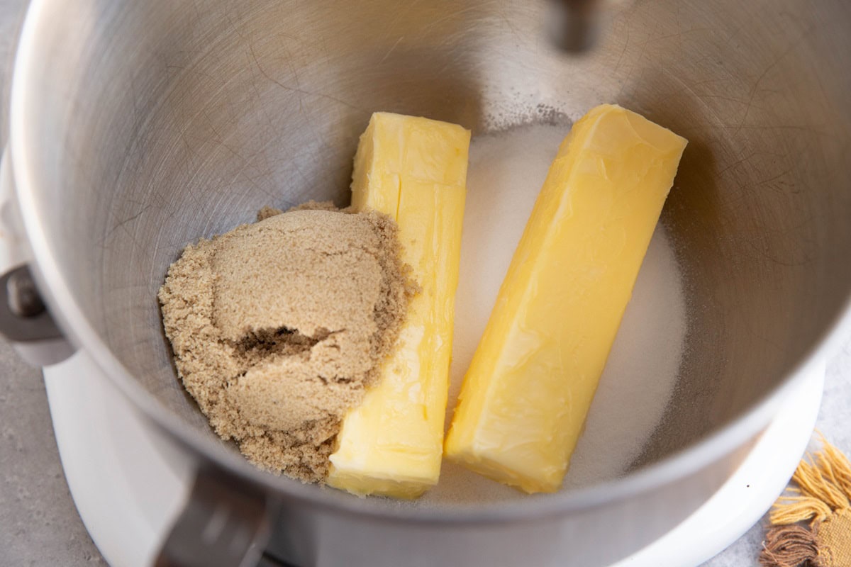 Butter and sugar in a stand mixer, ready to be mixed.