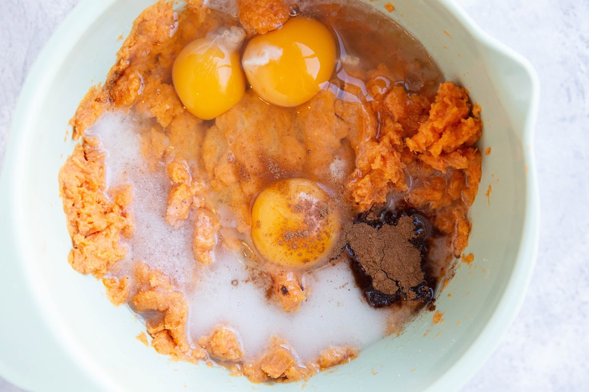 Wet ingredients for sweet potato crumble in a mixing bowl.