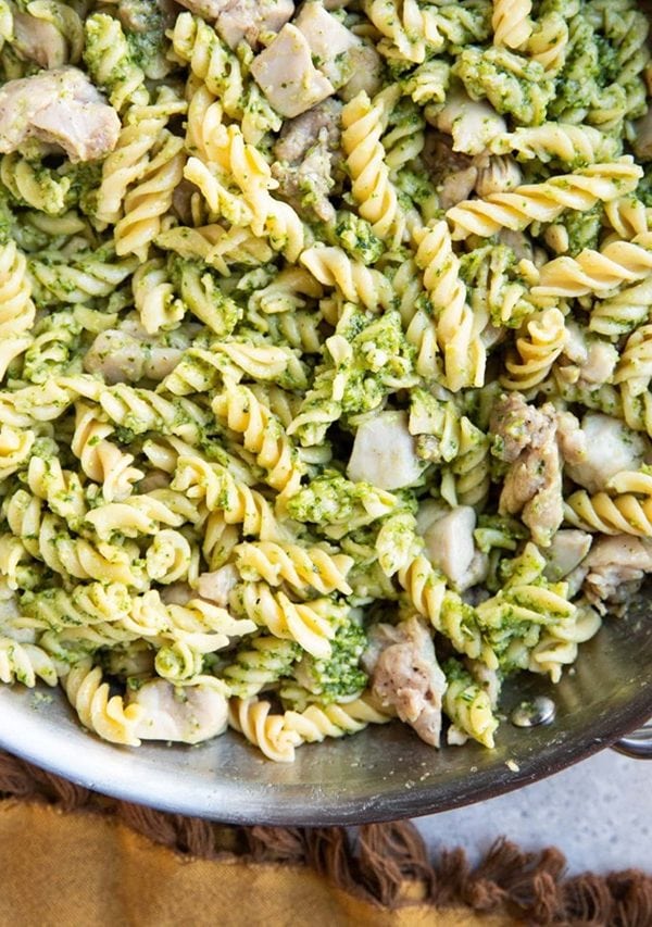 Chicken pesto pasta in a skillet, ready to serve.