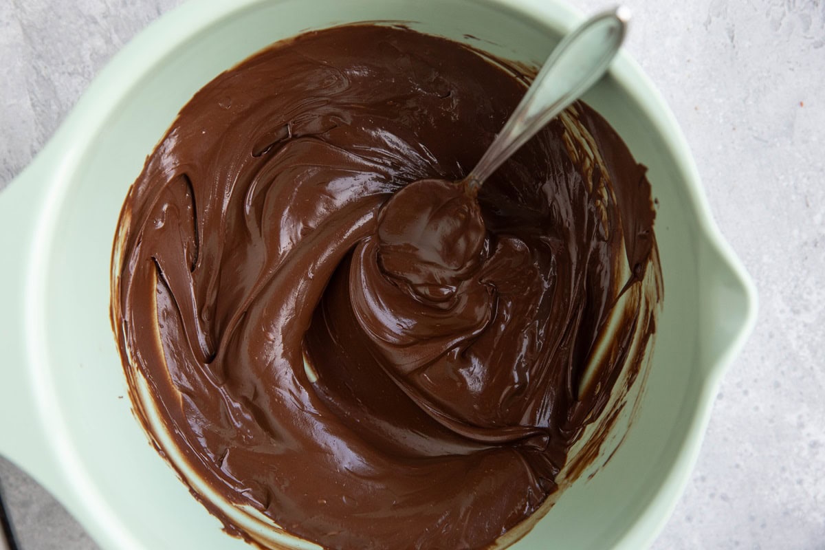 Melted chocolate in a mixing bowl.