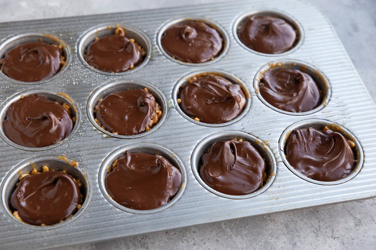 Muffin tin with peanut butter rice crispy treats.