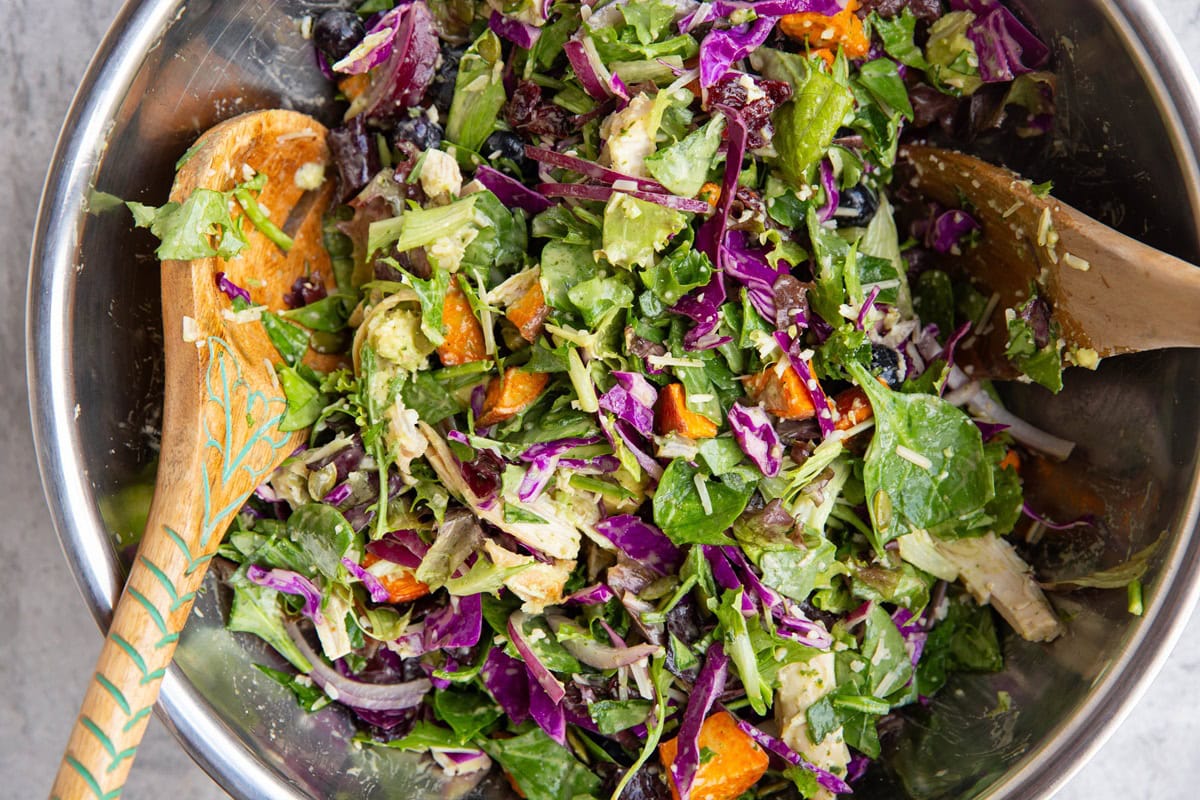 large stainless steel bowl full of salad