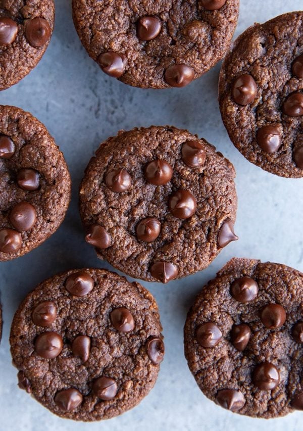 Oatmeal chocolate muffins sitting on a background, ready to eat