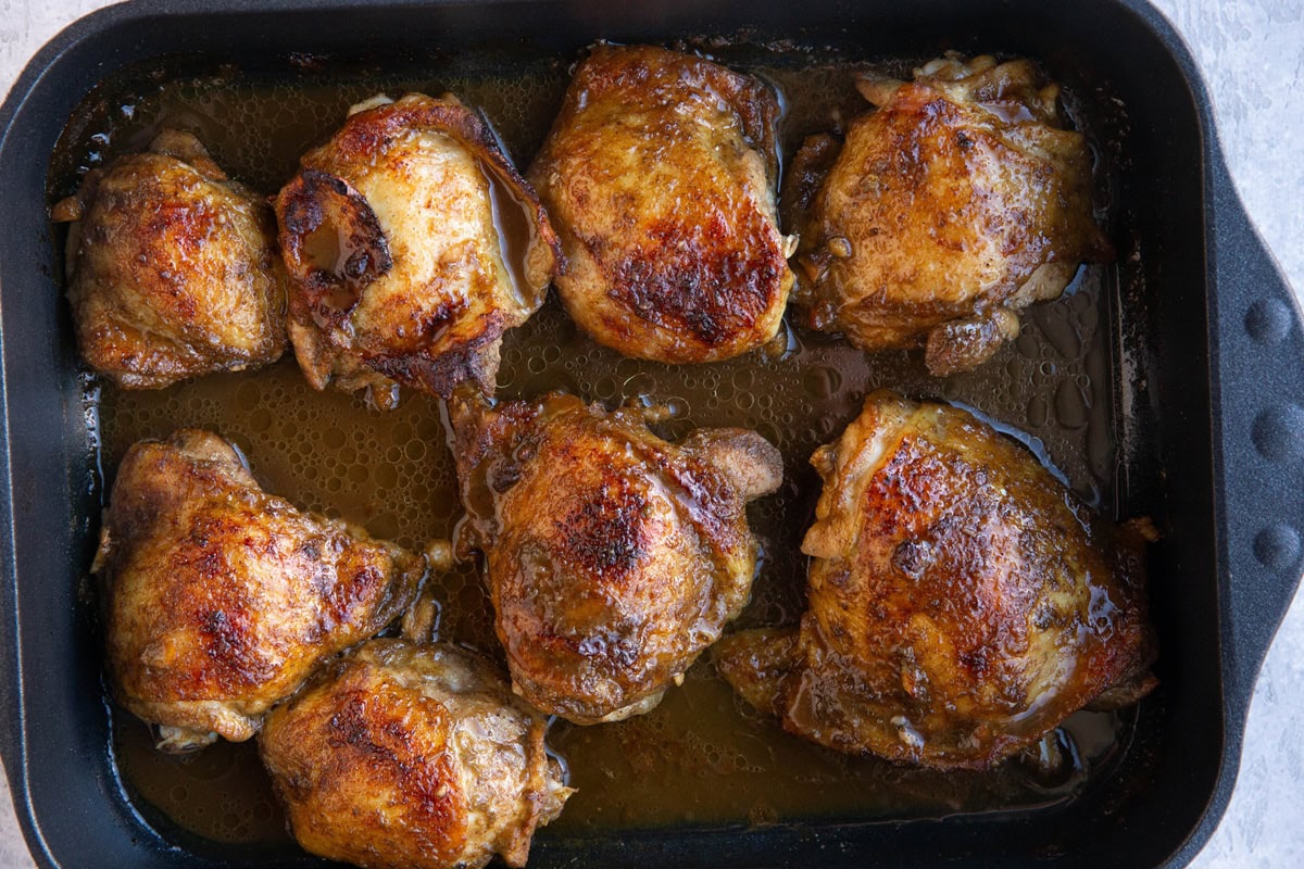 Jerk chicken in a casserole dish fresh out of the oven and ready to serve.