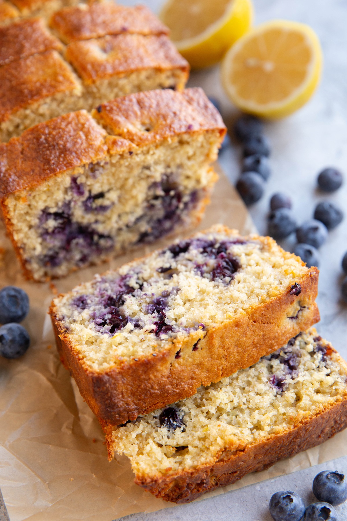 Loaf of lemon blueberry protein bread cut into slices.