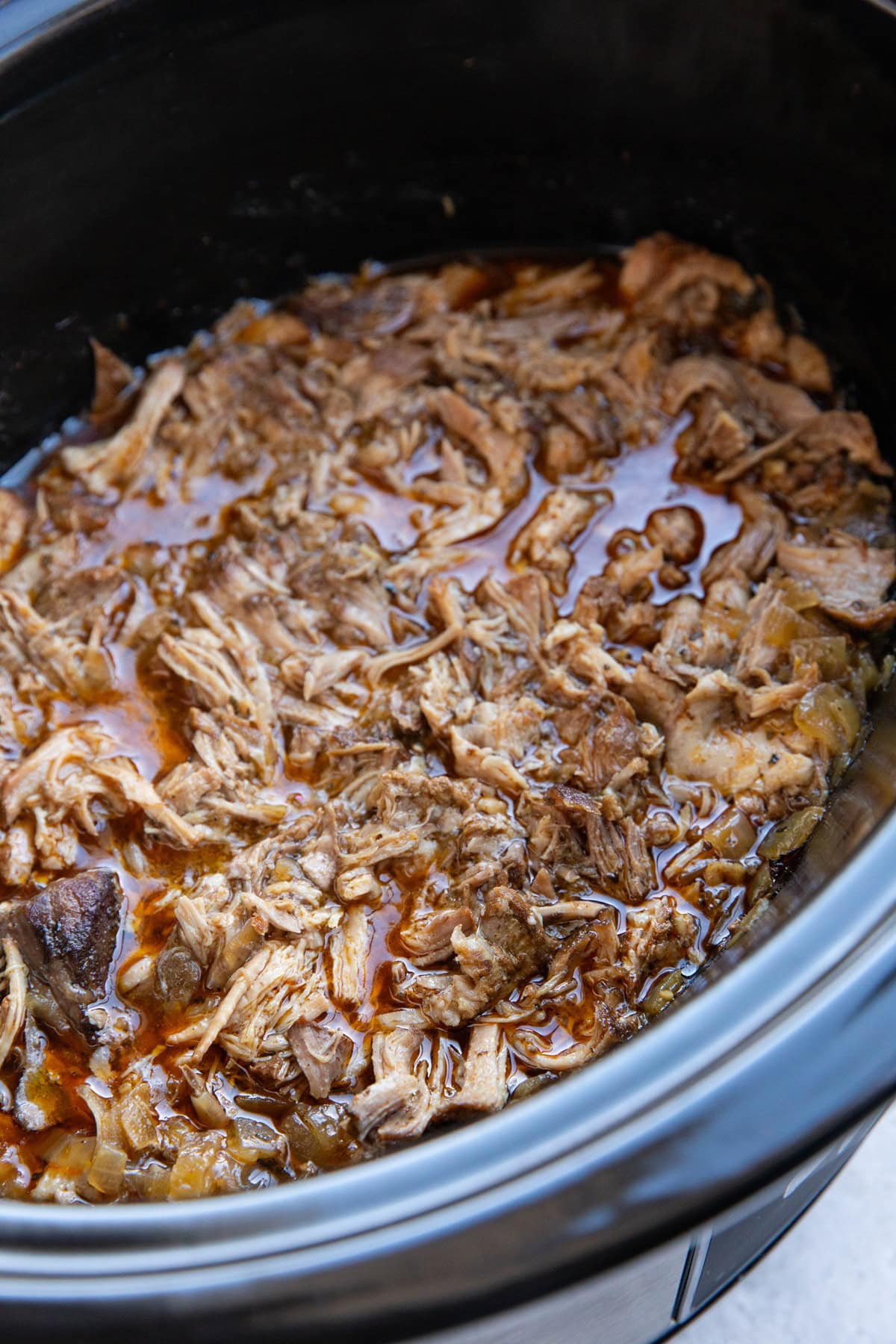 Slow cooker full of pork carnitas