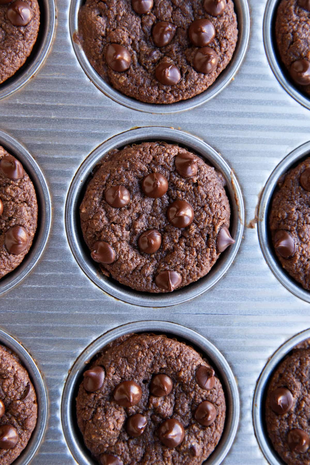 Muffin tray full of muffins.