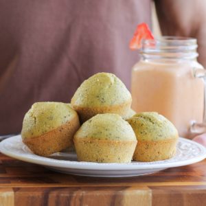 Plate full of lemon poppy seed muffins.