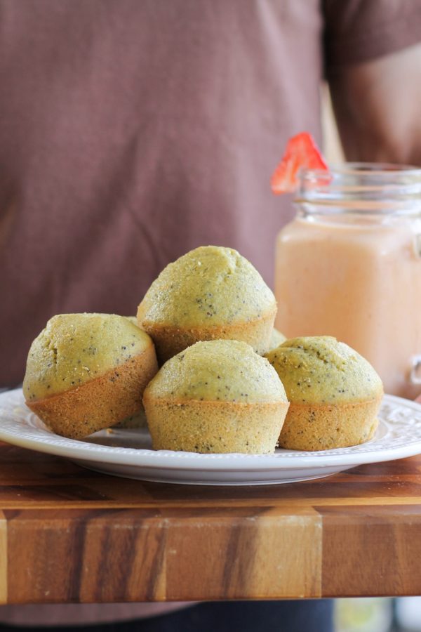 Plate full of lemon poppy seed muffins.