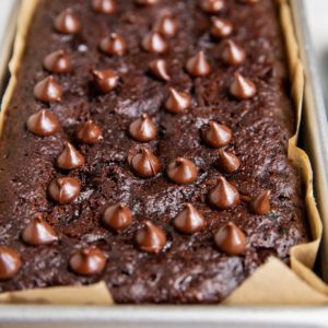 Loaf pan of almond flour chocolate bread, fresh out of the oven.