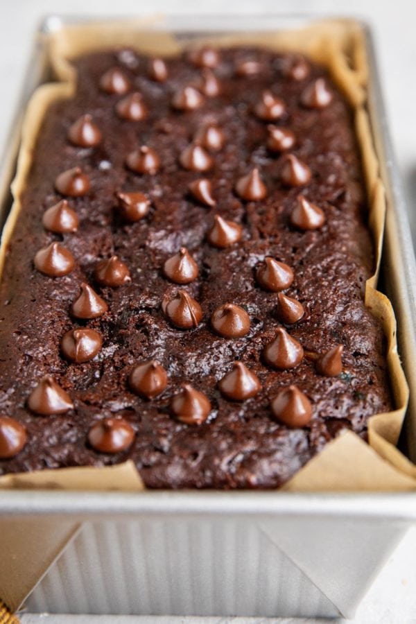 Loaf pan of almond flour chocolate bread, fresh out of the oven.