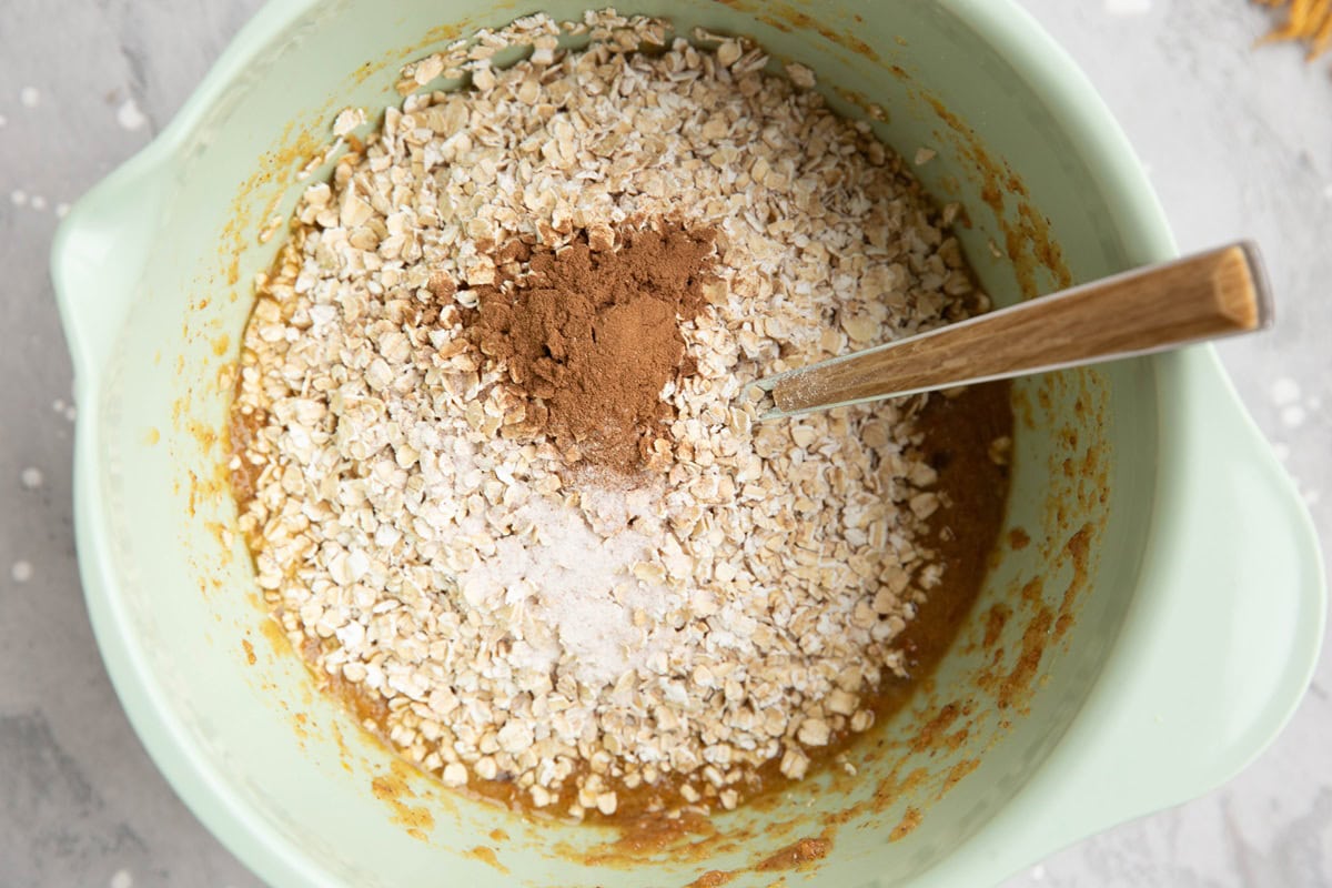 Dry ingredients on top of wet ingredients in a mixing bowl.