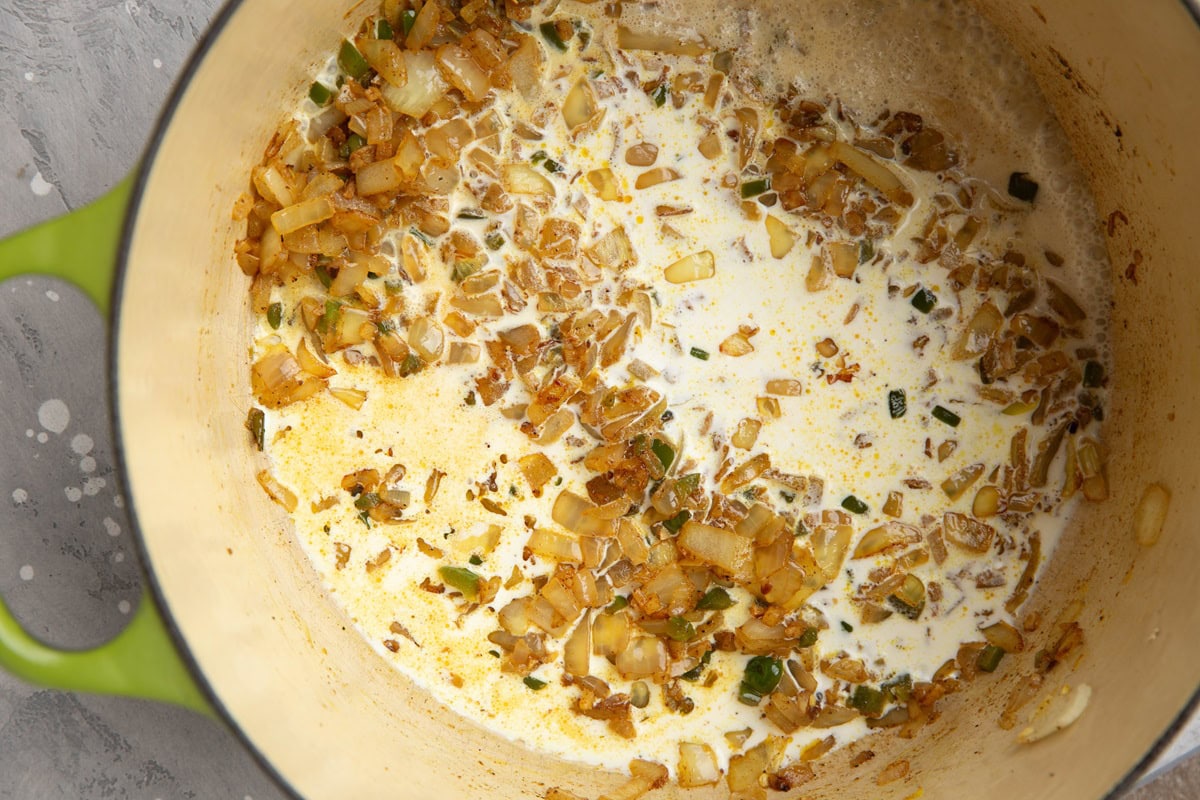 Heavy cream, onion, and seasonings in a large pot.