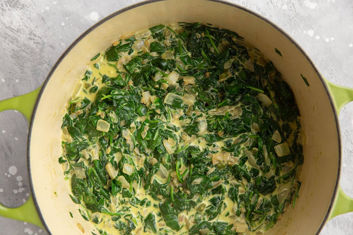 Large pot of spinach and cream to make saag paneer.