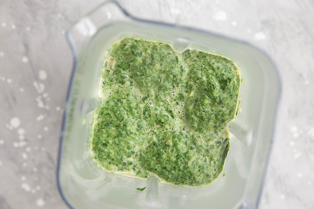 Blender full of blended spinach.