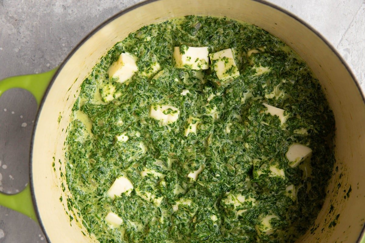 Large pot full of saag paneer, ready to serve and eat.