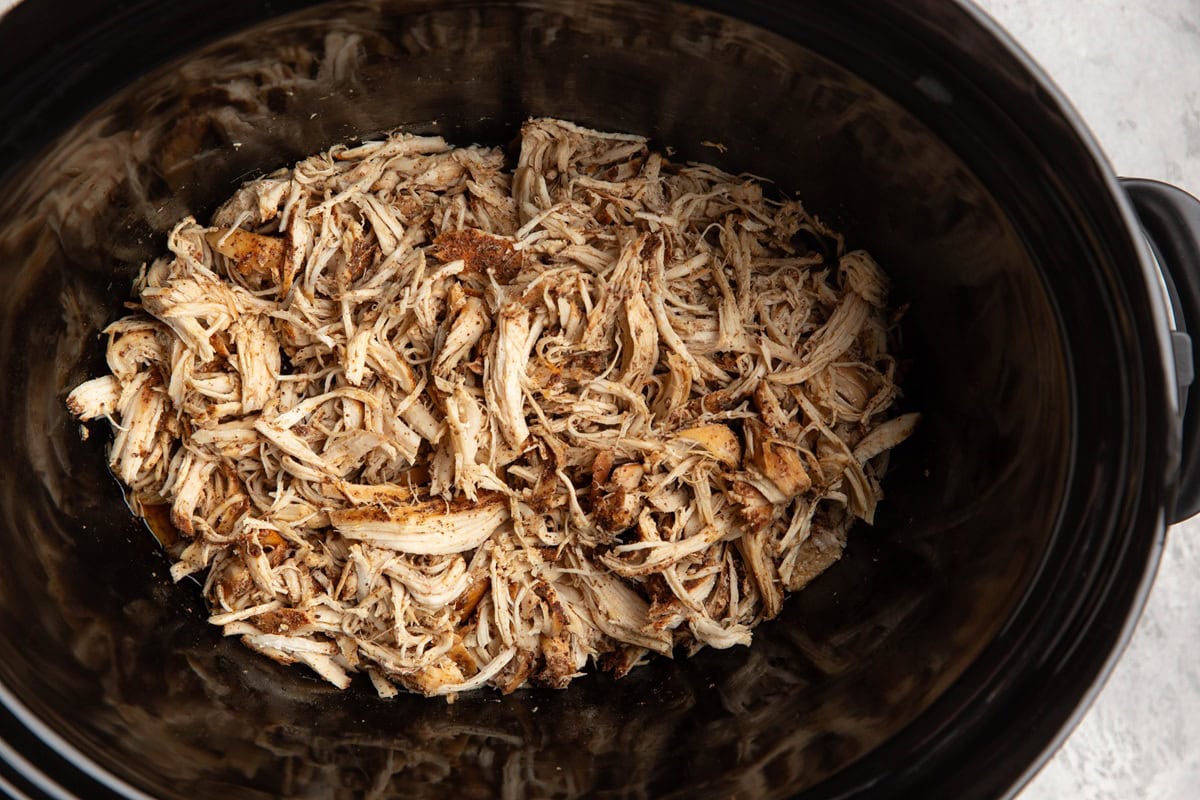 Crock pot full of shredded chicken.