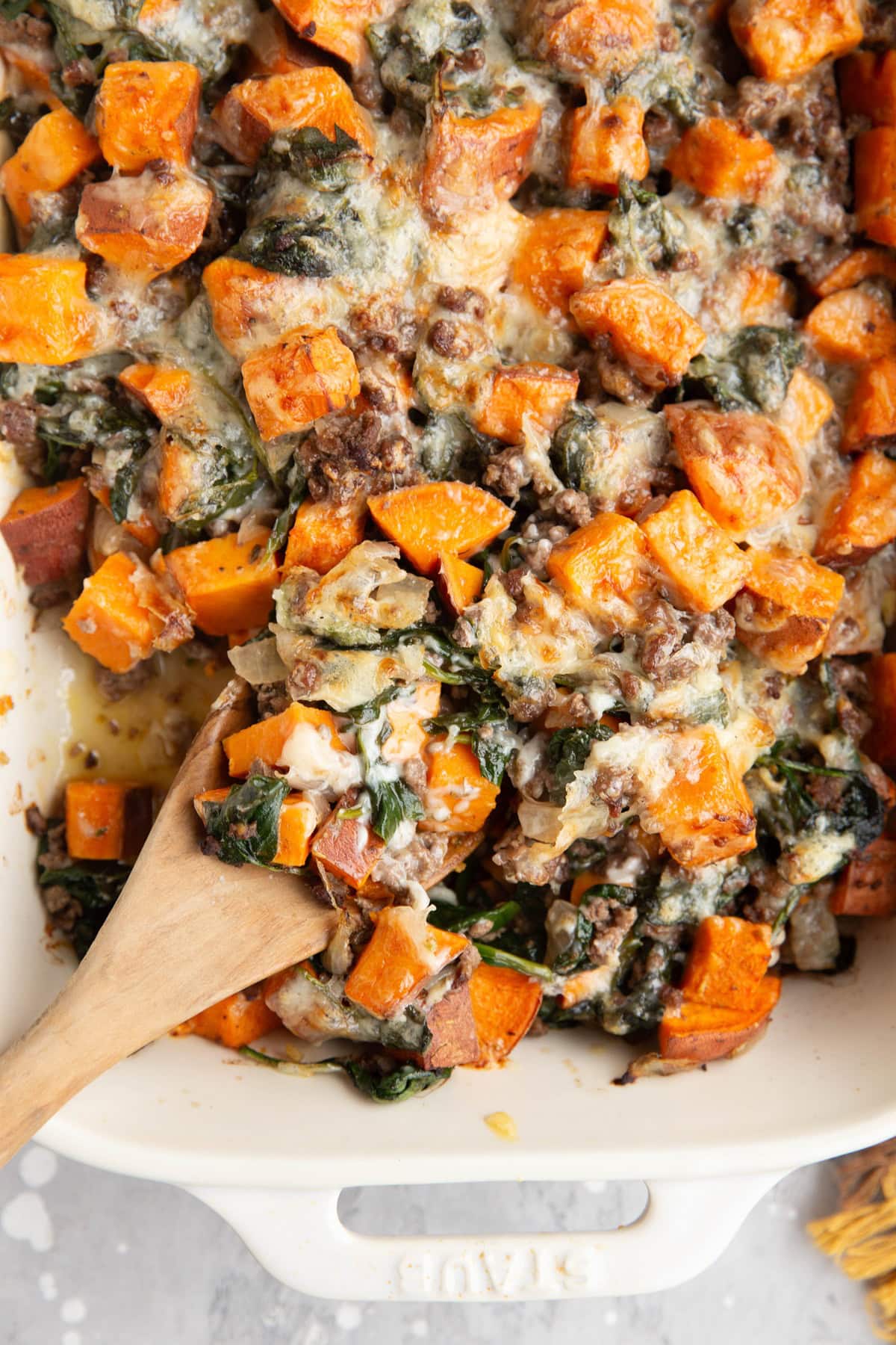 Casserole dish full of ground beef and sweet potatoes