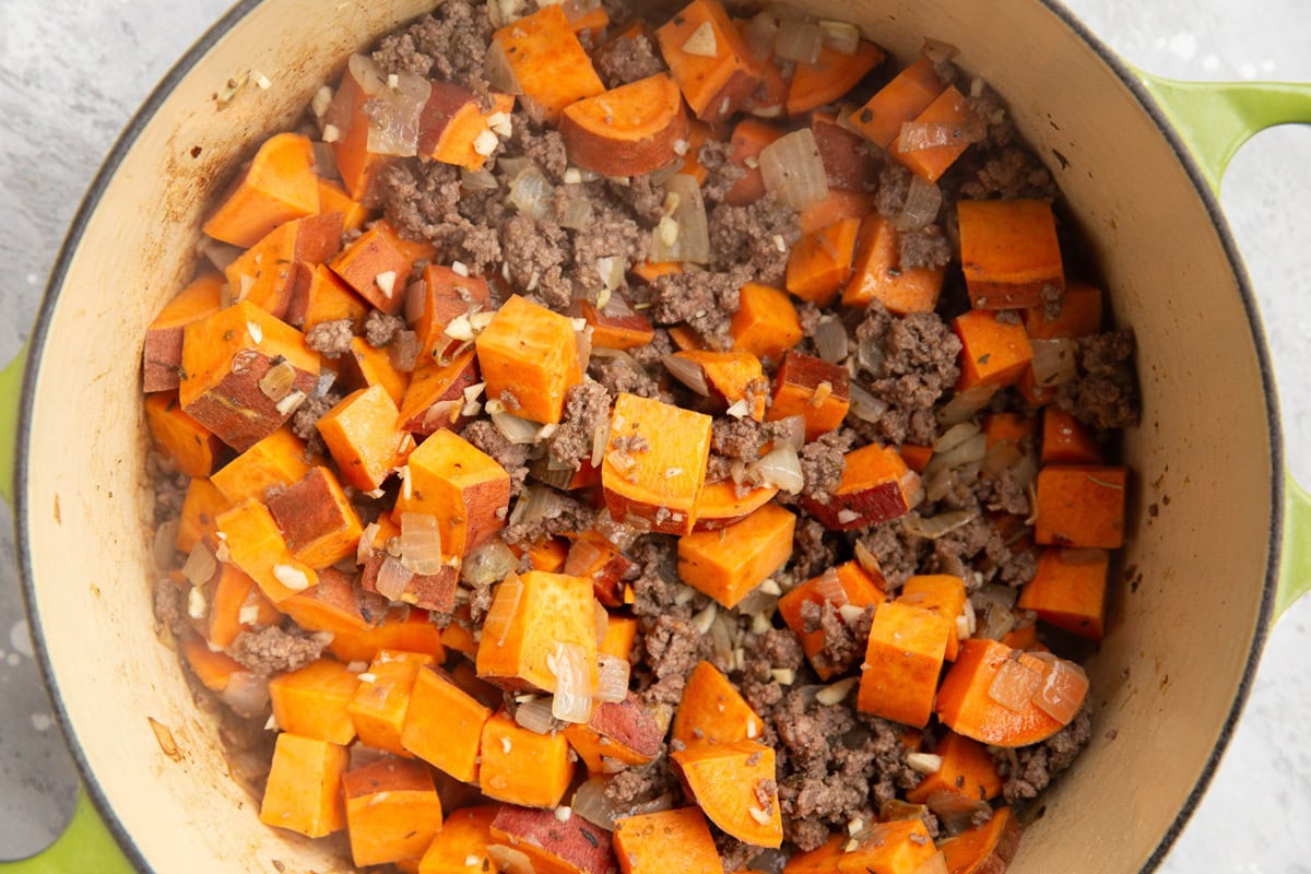 Large pot full of sweet potatoes and ground beef